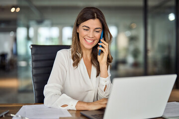 happy smiling mature middle aged business woman, 40s professional lady executive manager talking on 