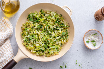 Wall Mural - Sauteed cabbage in a cast iron pan, side dish idea