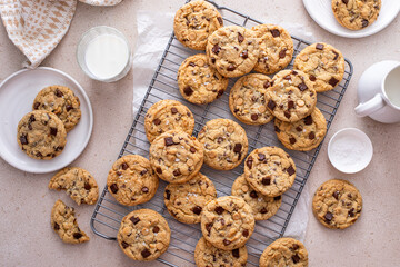 Wall Mural - Chocolate chip cookies on a cooling rack with flaky salt served with milk