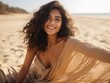 © Justlight - A beautiful South Asian woman lying on a warm beach watching the ocean with a smile on her face. She is radiating joy and bliss the soft sand beneath her being a perfect reminder of