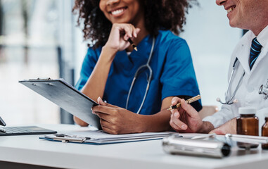 Wall Mural - Medical staff team african american meeting discussing chest x-ray film Radiologists medical doctors that specialize in diagnosing, treating injuries, diseases, radiology, procedures exams, tests