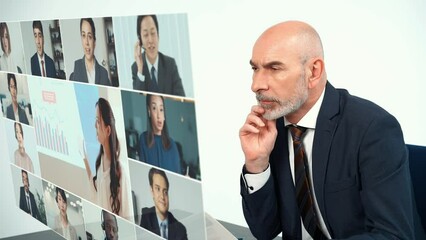 Aufkleber - Middle aged businessperson taking video conference with hologram screen.