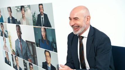 Aufkleber - Middle aged businessperson taking video conference with hologram screen.