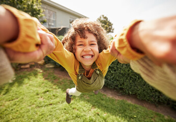 Kid, spin and outdoor in pov, holding hands and happy for game with parent, holiday or backyard. Excited young child, smile and swing in air, fast and grass for play on vacation, sunshine or portrait