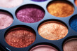 Palette of colorful eyeshadows close-up. Selective focus.