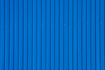 blue corrugated metal roof with rivets, industrial background