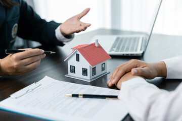 Banks approve loans to buy homes. Real estate agents explain the document for customers who come to contact to buy a house, buy or sell real estate concept.