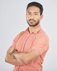 Poster - Portrait, confident and arms crossed with a serious asian man in studio on gray background. Fashion, mindset and pride with a young model posing in a pink shirt for trendy clothes style in Japan