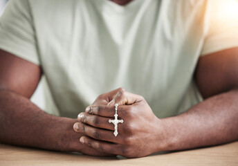 Wall Mural - Crucifix cross, man hands and prayer beads in home with faith, christian praise and religion. Praying, necklace and worship in house with hope, gratitude and spiritual guide for support and healing