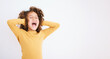 Shouting, loud and mockup with a girl child in studio on a white background covering her ears. Children, sound and audio with a young kid screaming or yelling on empty space for ADHD or autism