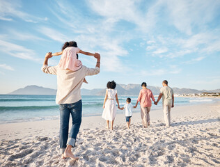 Wall Mural - Big family, holiday and walking on beach, holding hands and piggy back on summer island sand from behind. Parents, grandparents and kids adventure on tropical vacation together at ocean in Hawaii.