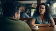 © Mickael - Unhappy, angry and stressed couple sitting on a coffee shop together and arguing. Mature man and chubby woman looking annoyed and ready for divorce. Generative ai