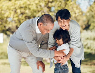 Wall Mural - Happy, hug and grandparents with child in park for playing, love and support. Care, smile and freedom with family and embrace on nature path for peace, summer vacation and happiness together