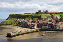 Whitby – With The 13 Century Abbey  And The Church Of Saint Mary On The Cliff Overlooking The Town,  North Yorkshire, England - Famously Linked By Bram Stoker's Novel Dracula.