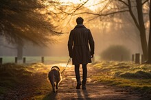 Man Walking His Dog In A Park, Enjoying A Peaceful Morning, Autumn Season - Pet Ownership And Nature - AI Generated