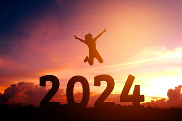 2024 Newyear Silhouette young woman jumping to Happy new year concept.