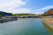Entering Staithes Harbour In Yorkshire At Low Tide.