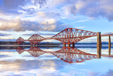 The Forth Rail Bridge, one of Scotland's most famous landmarks, with a reflection in the Firth of Forth.  Designed by engineers Sir John Fowler and Sir Benjamin Baker. Reflection has been added.