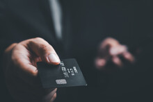 Businessman Is Using A Credit Card With A Smartphone For Financial Transactions. Online Banking Purchase Product On Internet In Home Office Or Online Shopping. Convenience In The World Of Technology.
