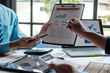 © Parichat - Asian business advisor meeting to analyze and discuss the situation on the financial report in the meeting room.Investment Consultant.