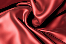 Red Swirled Silk  Fabric As Background. Swirl Cloth, Twisted Background, Twisted Cloth


