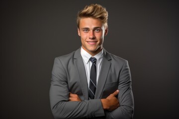 portrait of blonde hair young businessman in smile or happy expression on studio shoot grey background