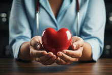 Cardiologist Doctor Holding A Red Heart In His Hands , Cardiac Disease Or Heart Failure Concept Image