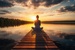 canvas print picture - Eine junge Frau meditiert auf einem Steg am See, Yoga