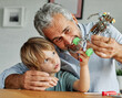 © Lumos sp - grandchild family child grandparent grandfather toy boy craft hobby creativity education happy fun grandson together senior learning model hand handcraft