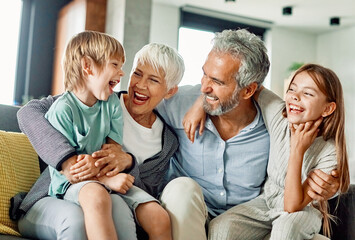 Wall Mural - grandchild family child grandparent grandfather happy together grandmother girl senior boy man woman