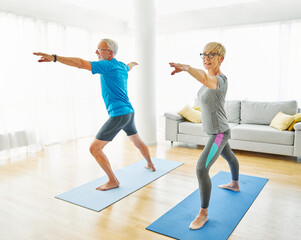 Wall Mural - senior active exercise couple training sport fitness home stretching yoga woman man pilates gym together