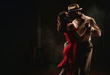 Couple Of Professional Tango Dancers In Elegant Suit And Dress Pose In A Dancing Movement On Dark Background.