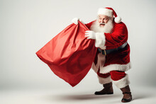 Santa Claus Pulling Huge Bag Of Presents Isiolated On White Background With Copy Space.