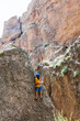 © zhukovvvlad - climber boy. a child in a helmet climbs a rock. sports on the street.