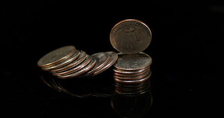 Wall Mural - Quarter Dollar Coins Falling, Rolling and Sliding on Black Background