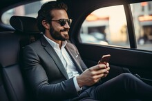 Businessman Traveling From The Office In The Back Seat Of A Car