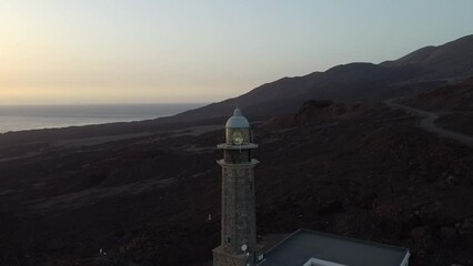 Wall Mural - aerial orbital shot of the lighthouse of Orchilla at sunset  in the island of el hierro (canary islands)