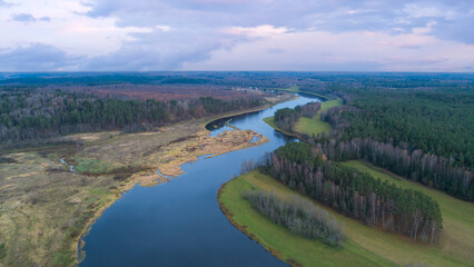 Aufkleber - Aerial panoramic landscape with sunset over the river with islands and beautiful clouds on the sky.