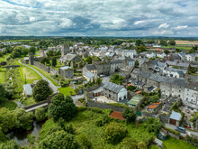 Aerial View Of Fethard Old Medieval Walled Town In County Tipperary On The Clashawley River With Gothic Church And Mural Tower House