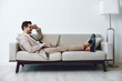 © SHOTPRIME STUDIO - Man couch sofa business laptop home call video
