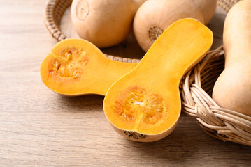 Canvas Print - Butternut squash pumpkin in basket on wooden table, Organic vegetable in autumn season