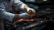 © AspctStyle - Close up man pouring machine oil into a car engine through car engine, Service station for damaged autos concept
