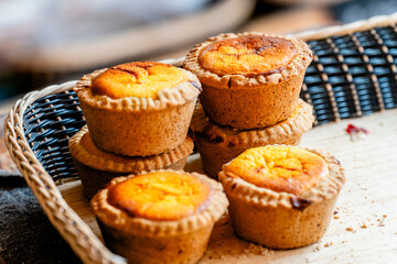 muffins in a basket on a wooden table - mexican bread