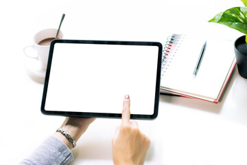 Poster - Woman hoilding blank screen tablet finger touching on white screen. Empty white screen for copy space and advertising text.