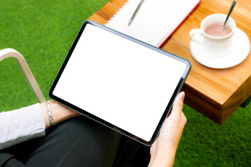 Poster - Woman holding and using tablet black screen white background for copy space and advertising text, work from home concept.