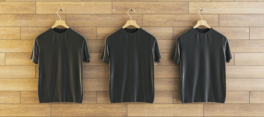 Aufkleber - Three empty black t-shirts hanging on woooden wall background. Ad, textile and fashion concept. 3D Rendering.