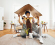 Portrait, family and a boy with cardboard for insurance in the living room of their home together. Mother, father and daughter in a house for security or safety in real estate and property finance