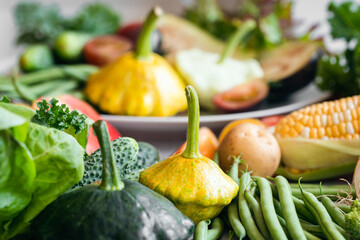 Wall Mural - Background of vegetables and herbs on the kitchen table.