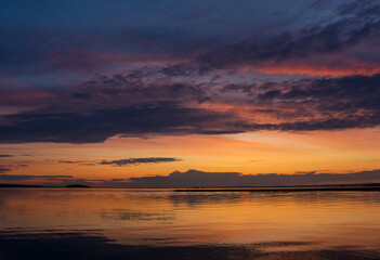 Wall Mural - natural landscape with a beautiful sunset over the wide northern lake