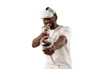 african american man in white t-shirt plays video games in virtual reality glasses and aims and holds control panel